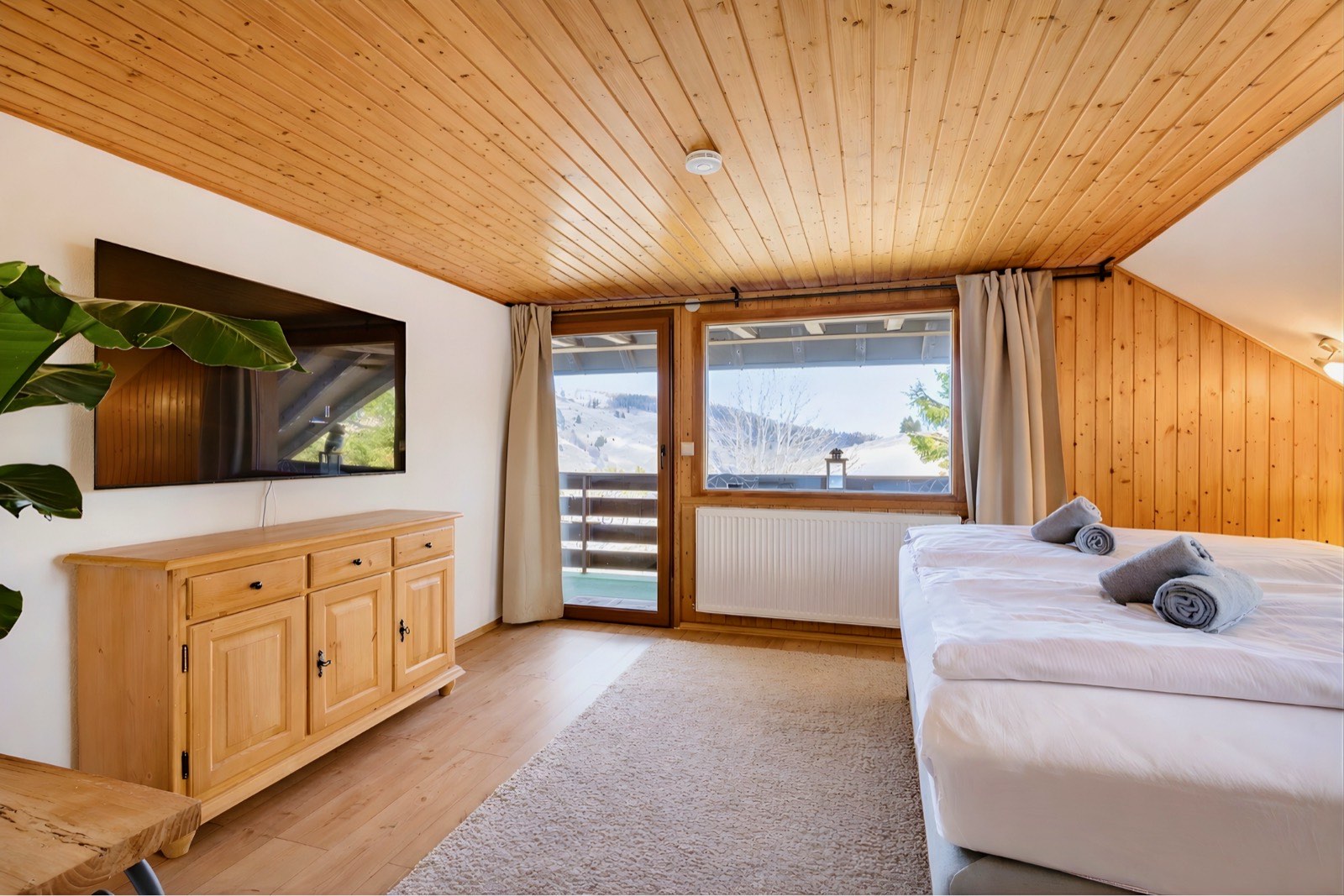 Bedroom with smart TV and sideboard