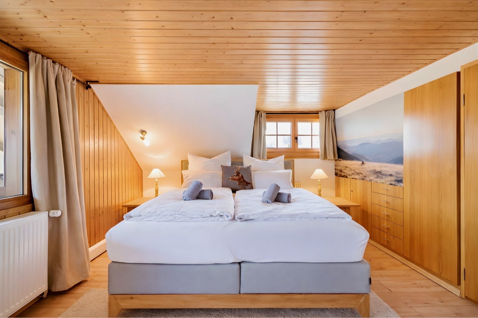 Bedroom with panoramic wall mural and window