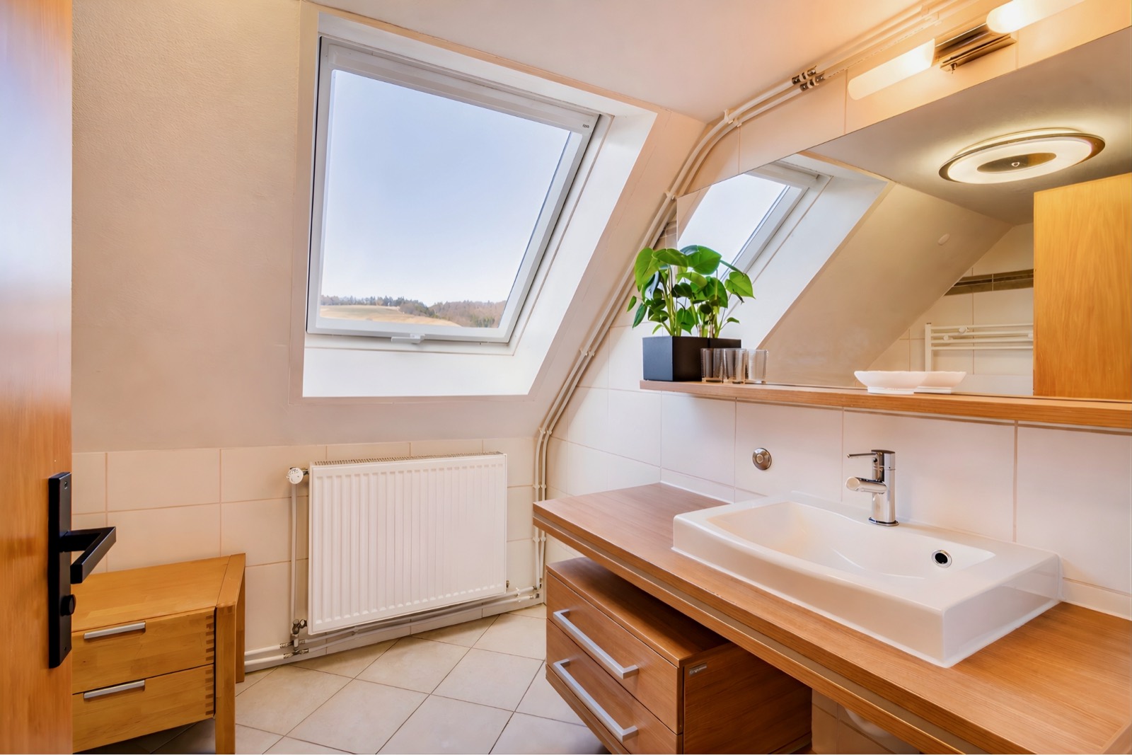 Bathroom with washbasin under the skylight