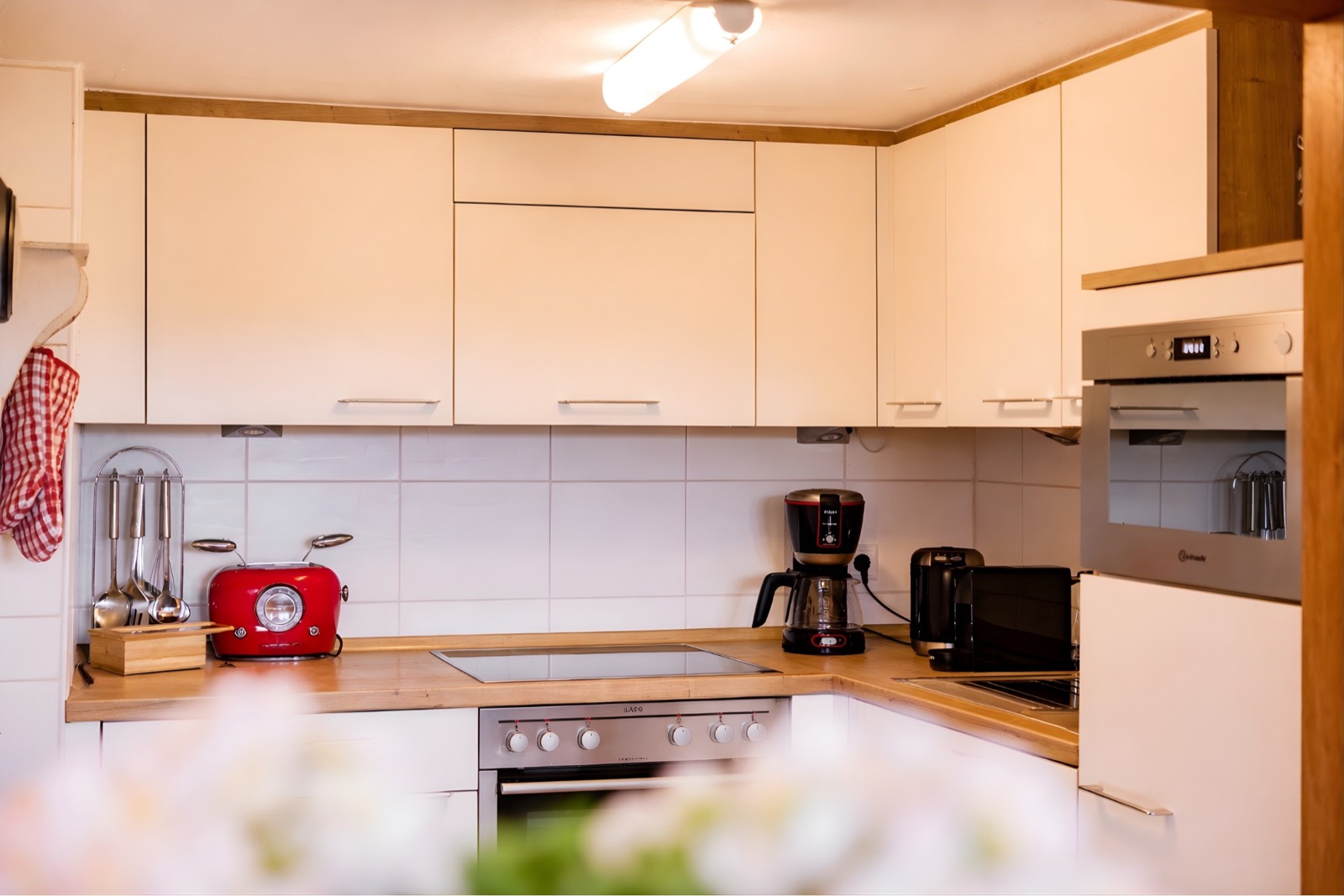 Kitchen counter with red toaster and coffee machine