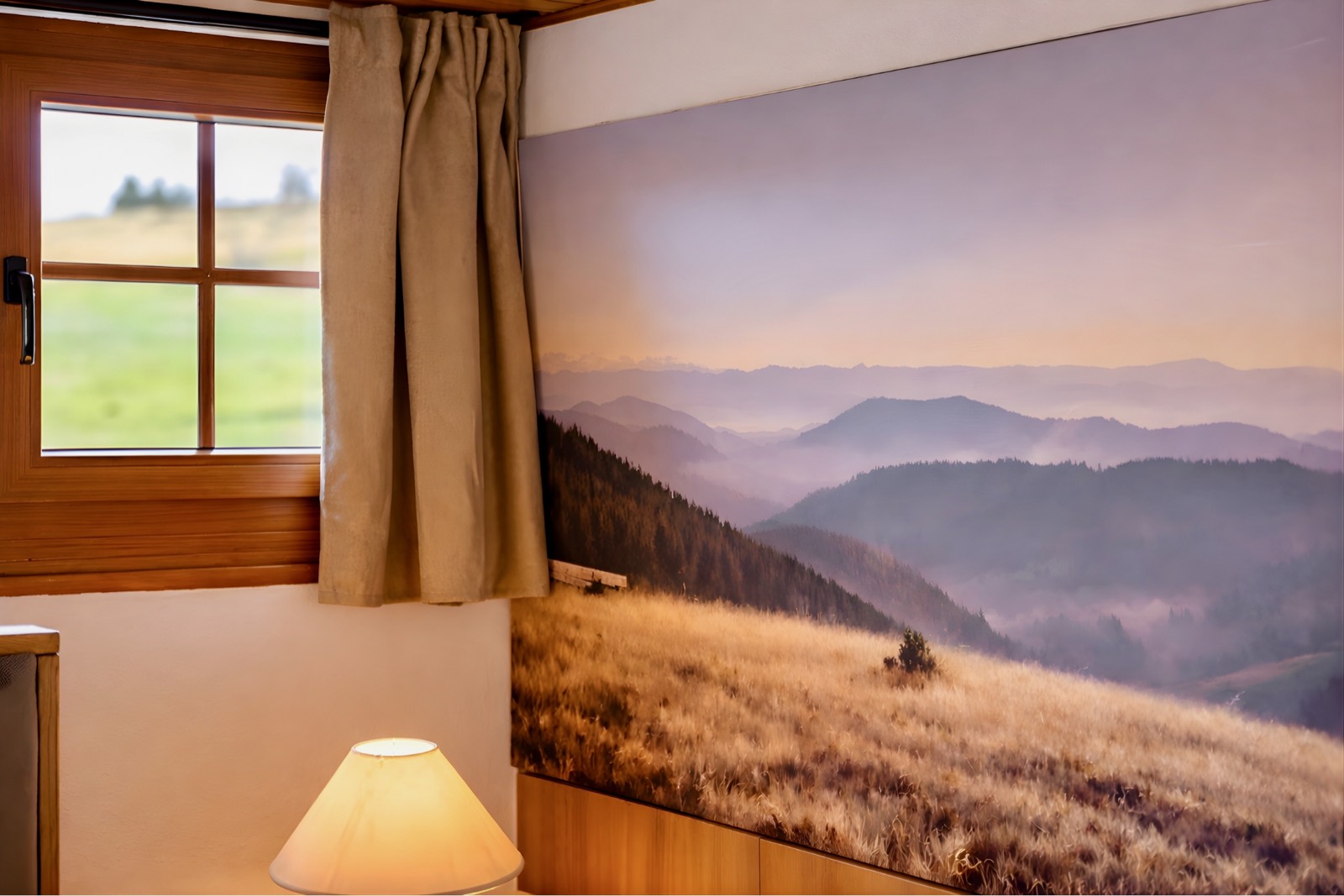 Wall mural of a Black Forest landscape beside a warm lamp